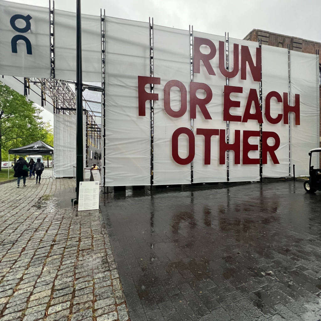 Sign at Penn Relay's that says "Run for Each Other"