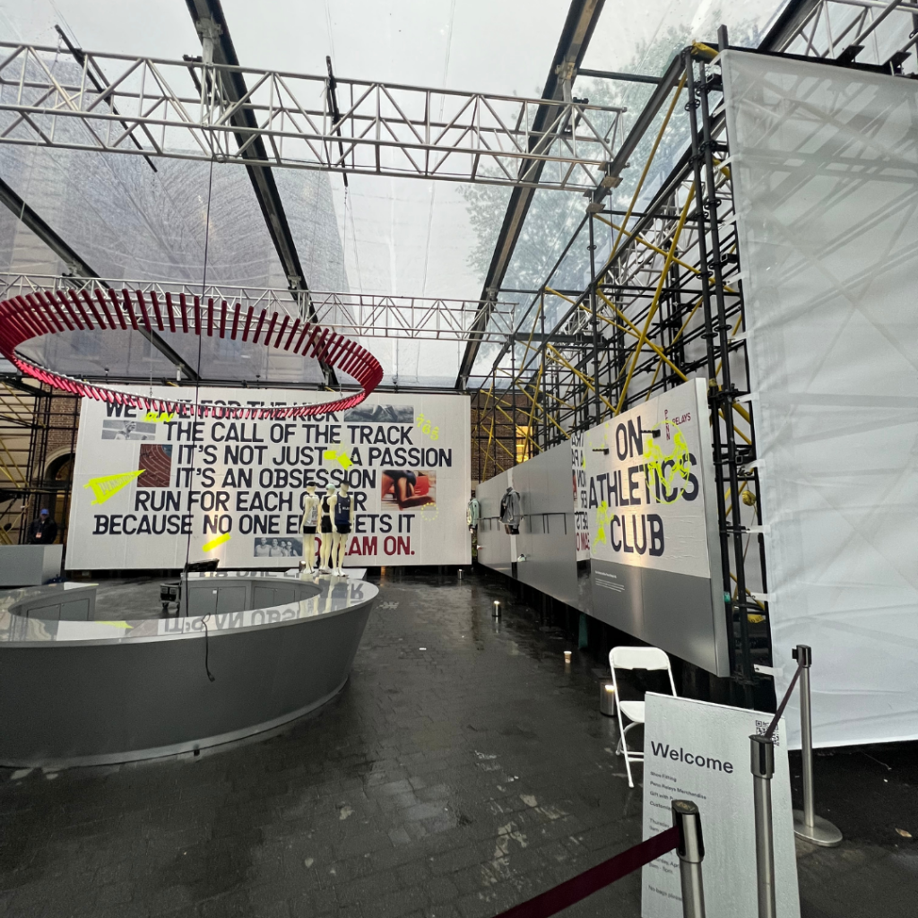 Inside the custom structure showing motivating sign and clothes that can be bought at Penn Relay's 